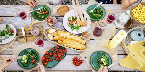 heavy duty wooden table with lots of food on