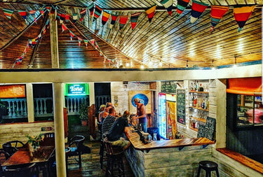 brightly coloured cotton bunting in bar